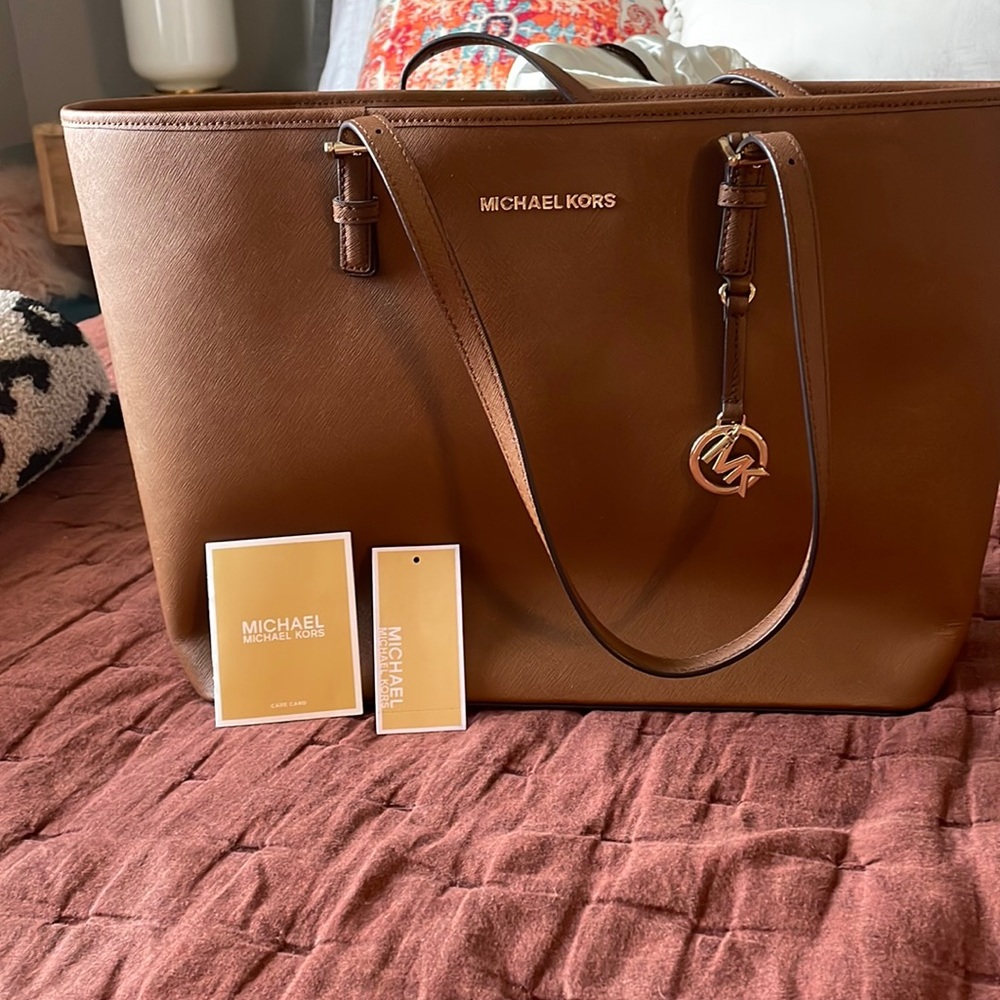 Micheal Kors new with tags jet set travel luggage. Large carry all tote.